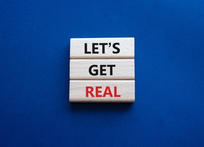 "Let's get real" written on blocks